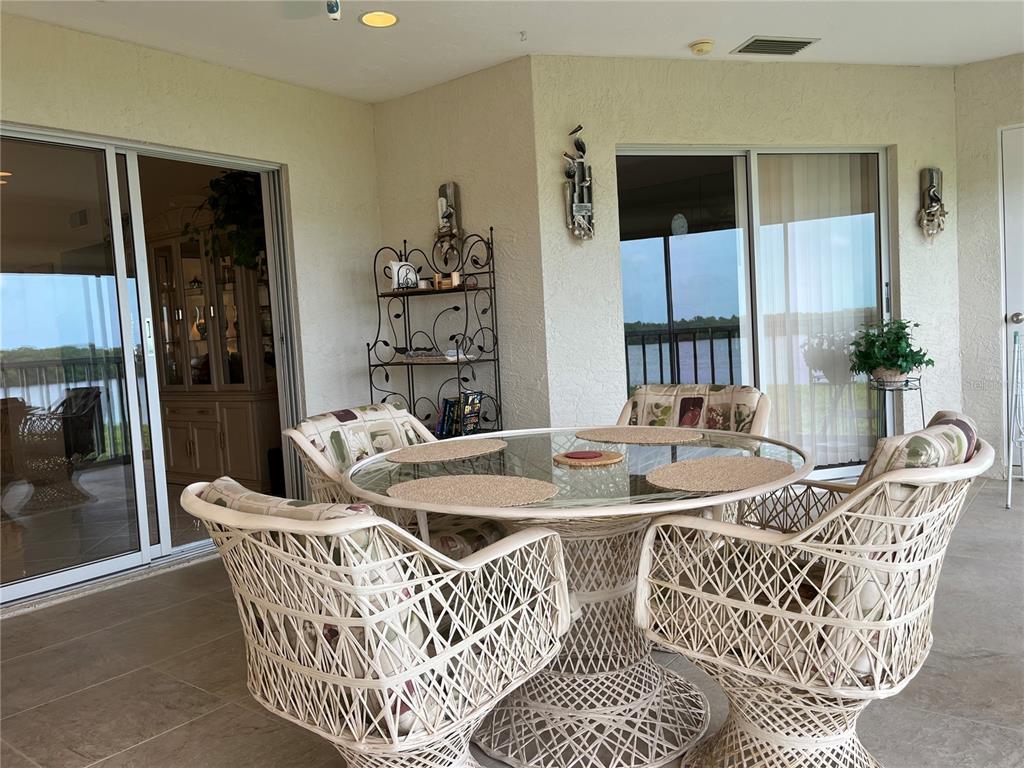 1397 Perico Point Circle, Unit 1397 Bradenton, FL 34209 - Photo 24 of 39 a dining room with furniture