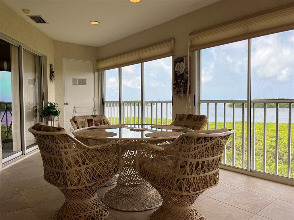 1397 Perico Point Circle, Unit 1397 Bradenton, FL 34209 - Photo 25 of 39 a living room with furniture and a large window