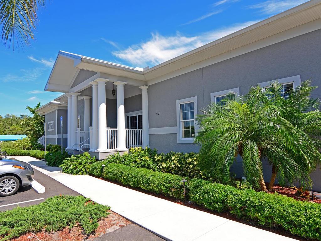 1397 Perico Point Circle, Unit 1397 Bradenton, FL 34209 - Photo 36 of 39 a front view of a house with garden