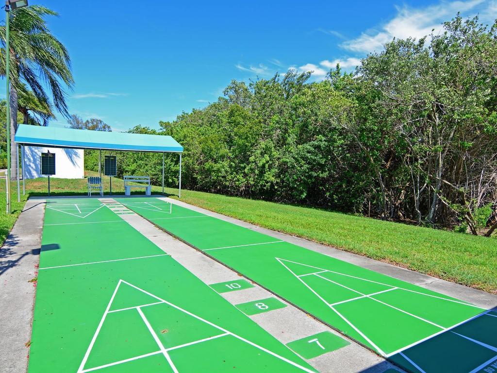 1397 Perico Point Circle, Unit 1397 Bradenton, FL 34209 - Photo 38 of 39 a view of an outdoor space and tennis court