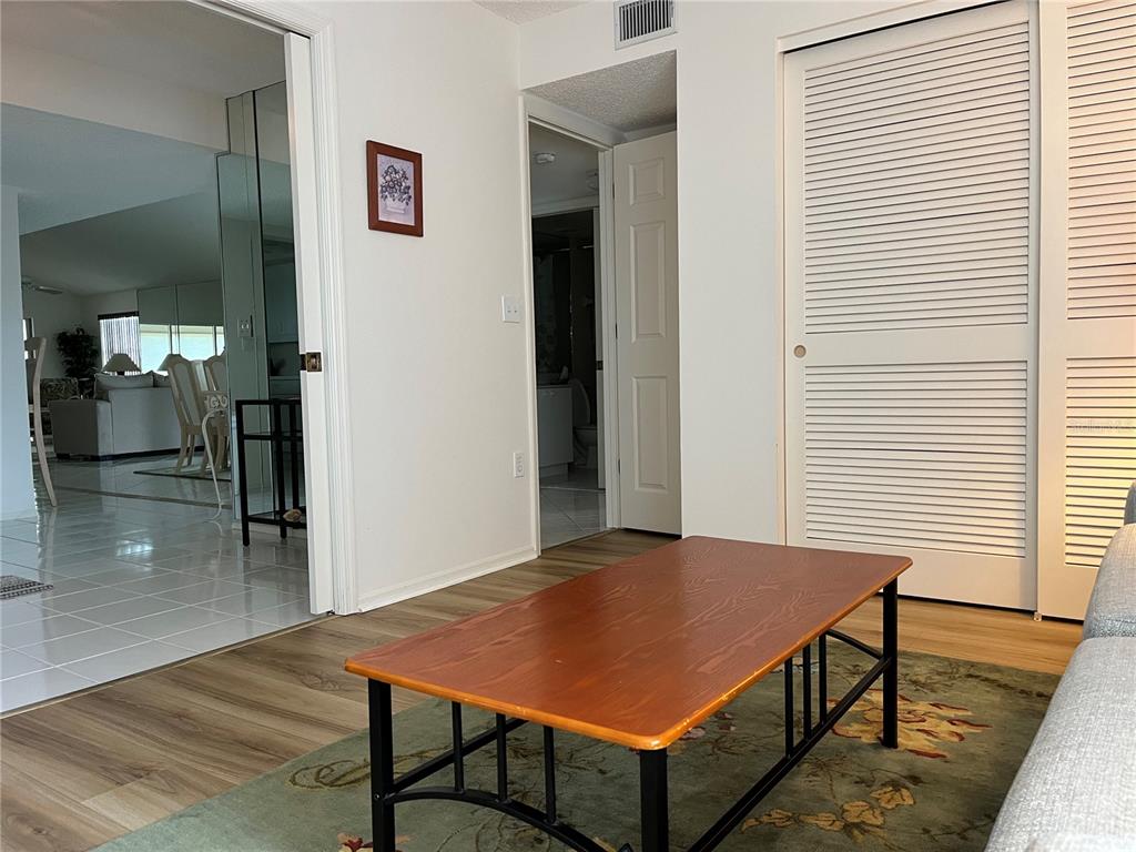 1397 Perico Point Circle, Unit 1397 Bradenton, FL 34209 - Photo 7 of 39 a view of a room that has a table and chairs in it