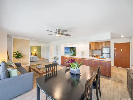 a view of a dining room with furniture and wooden floor