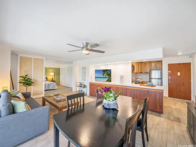 a view of a dining room with furniture and wooden floor