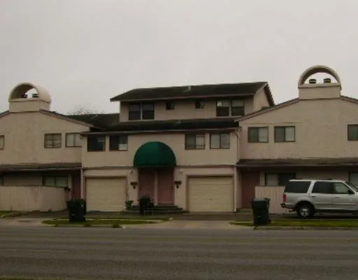 a front view of a house with a parking garage
