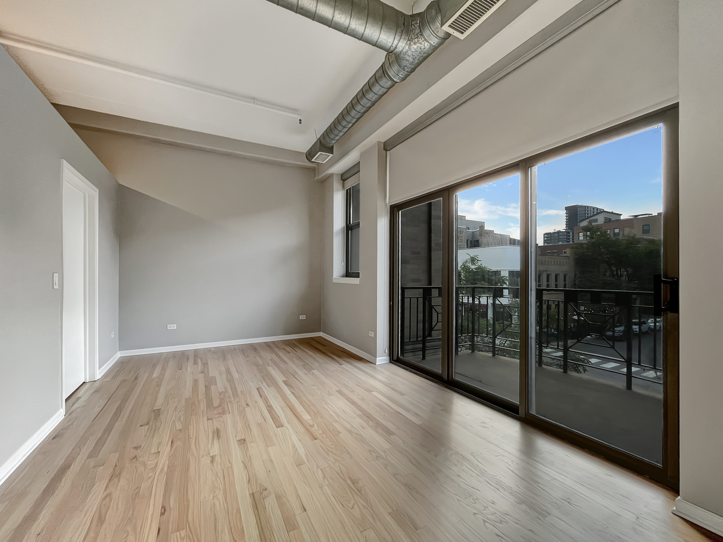 1301 West Madison Street, Unit 201 Chicago, IL 60607 - Photo 8 of 14 a view of livingroom with floor to ceiling window