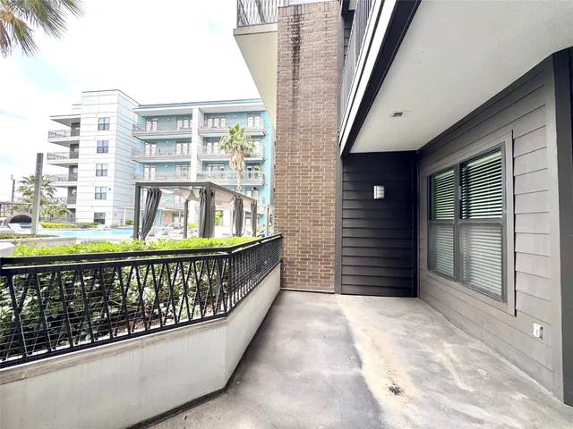 a kitchen with kitchen island a sink stainless steel appliances and cabinets