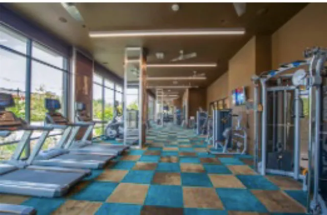 a dining room with furniture and a floor to ceiling window