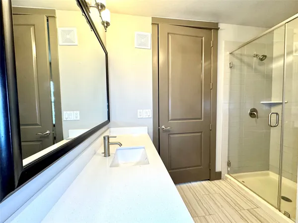 a bathroom with a tub and shower