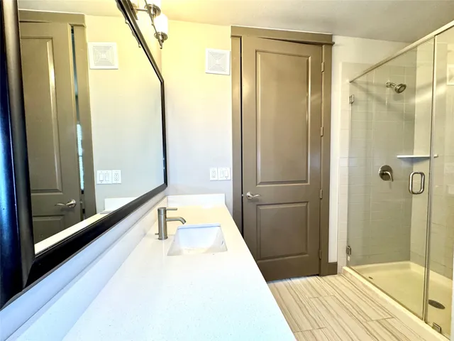 a bathroom with a tub and shower