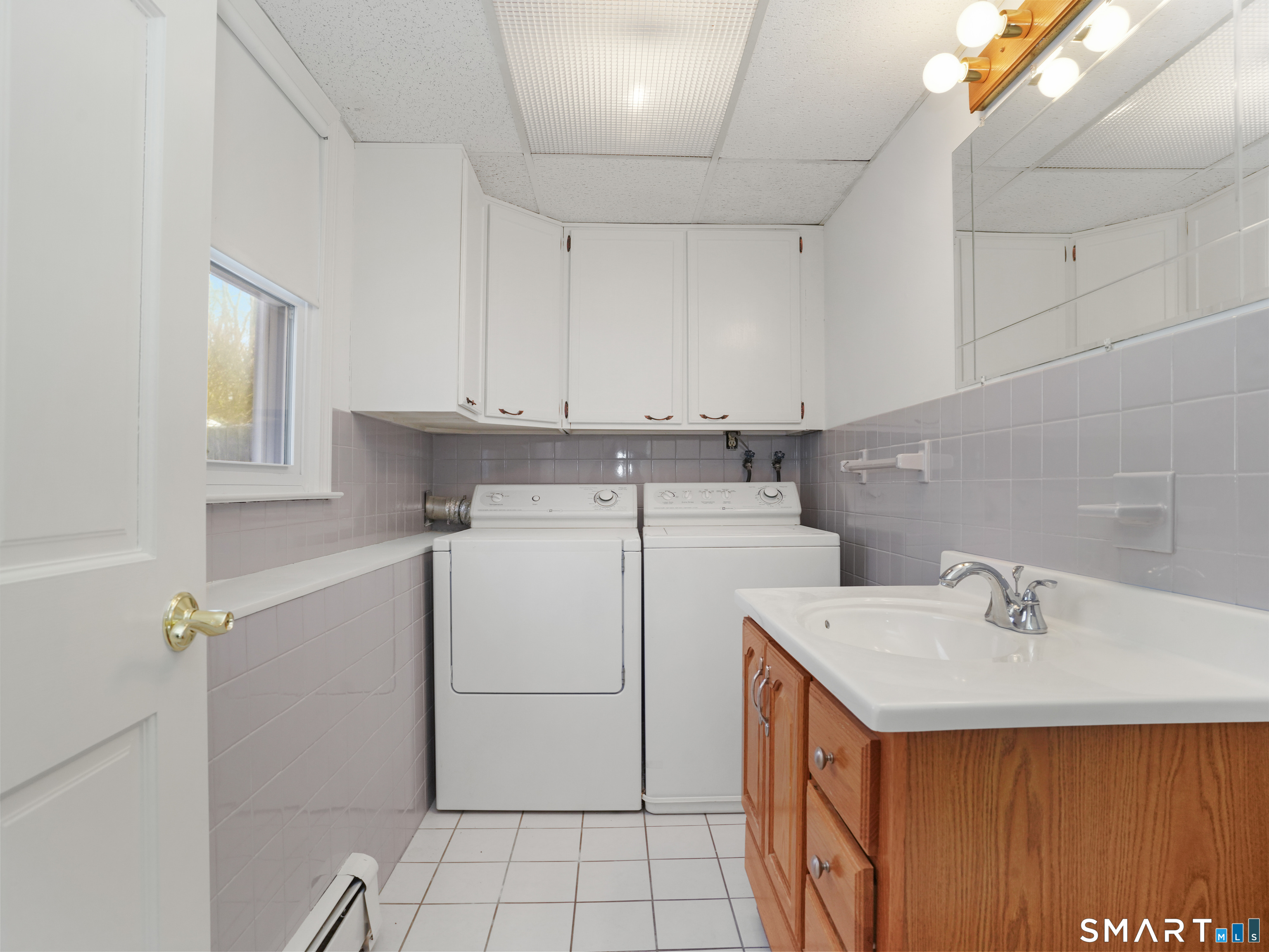 158 Mayfair Road Fairfield, CT 06824 - Photo 12 of 31 Lower Level Laundry Room & Half Bath