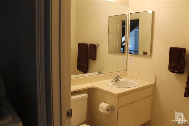 470 West Wooley Road Oxnard, CA 93030 - Photo 11 of 17 a bathroom with a sink and a mirror