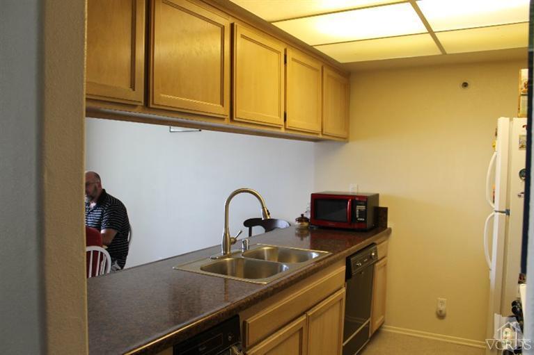 470 West Wooley Road Oxnard, CA 93030 - Photo 12 of 17 a kitchen with a sink and cabinets