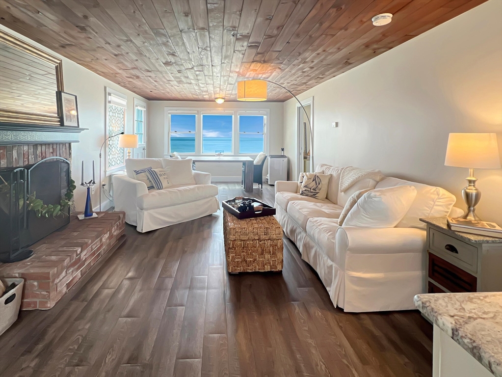 a bedroom with furniture and a fireplace