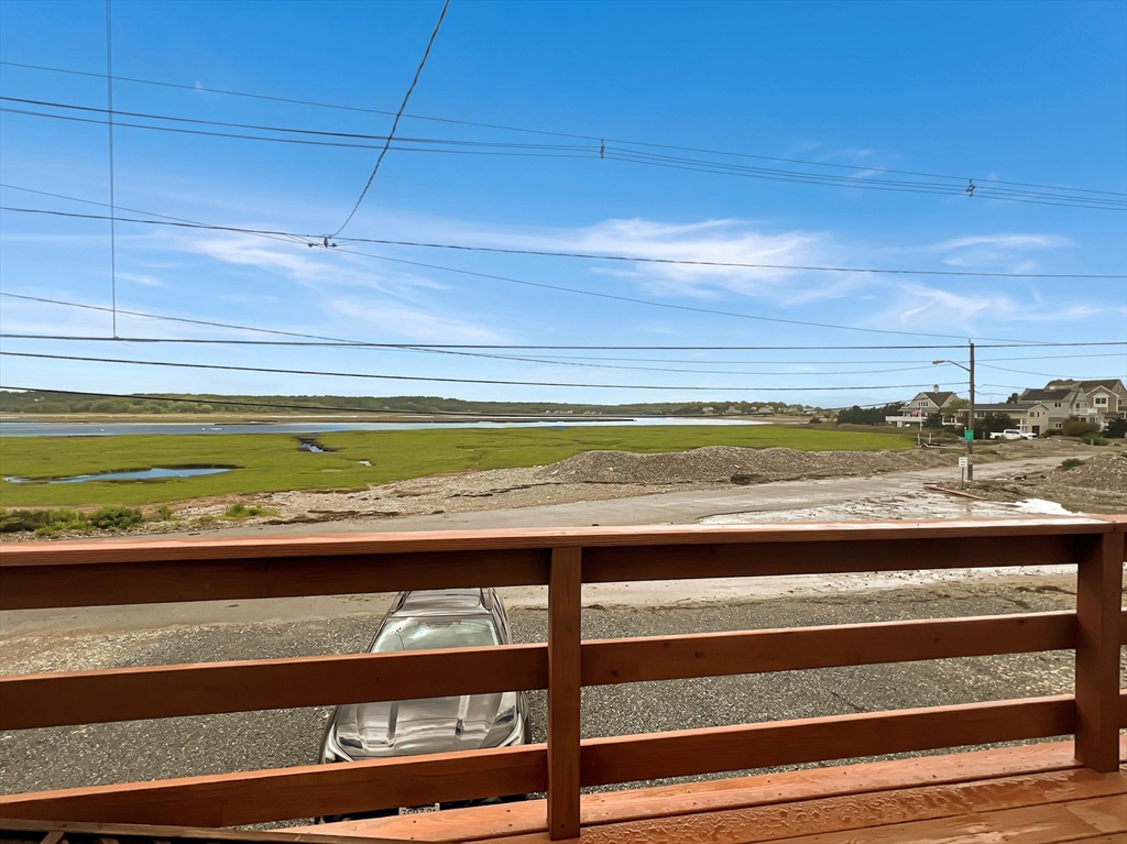 296 Central Avenue Scituate, MA 02050 - Photo 12 of 37 a view of a room with wooden floor and a bench