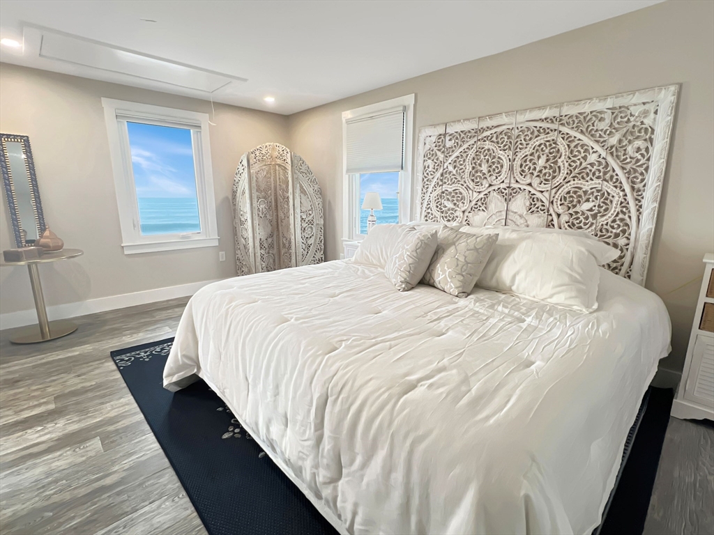 296 Central Avenue Scituate, MA 02050 - Photo 22 of 37 a bedroom with a large bed and a window