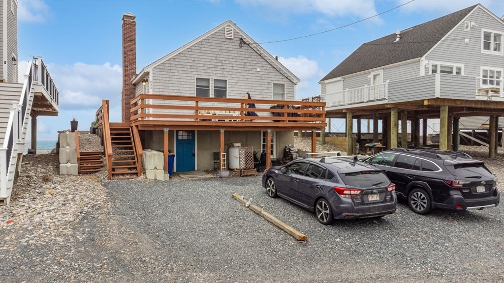 296 Central Avenue Scituate, MA 02050 - Photo 36 of 37 a car parked in front of white house