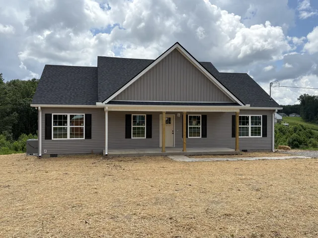 a front view of the house with yard