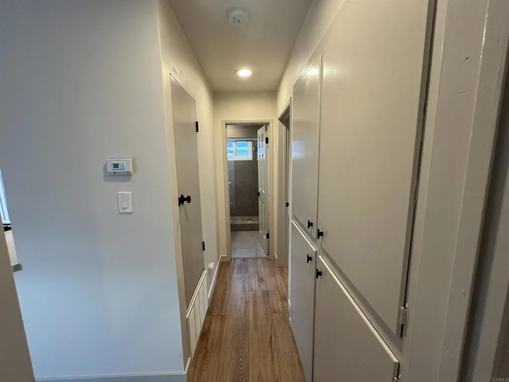 804 Clark Avenue Encinitas, CA 92024 - Photo 25 of 50 a view of a hallway with wooden floor and staircase