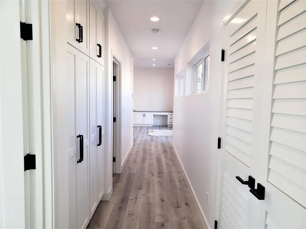 804 Clark Avenue Encinitas, CA 92024 - Photo 39 of 50 a view of a hallway with wooden floor and staircase