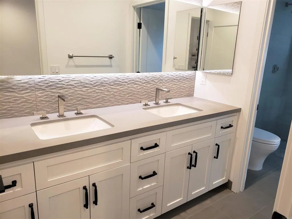 804 Clark Avenue Encinitas, CA 92024 - Photo 45 of 50 a bathroom with a sink and a mirror