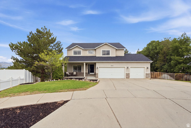 11882 Pond Ridge Drive Draper, UT 84020 - Photo 1 of 49 Two-story residence featuring a stucco exterior, stone accents, and a covered front porch