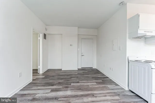 a view of a kitchen with wooden floor
