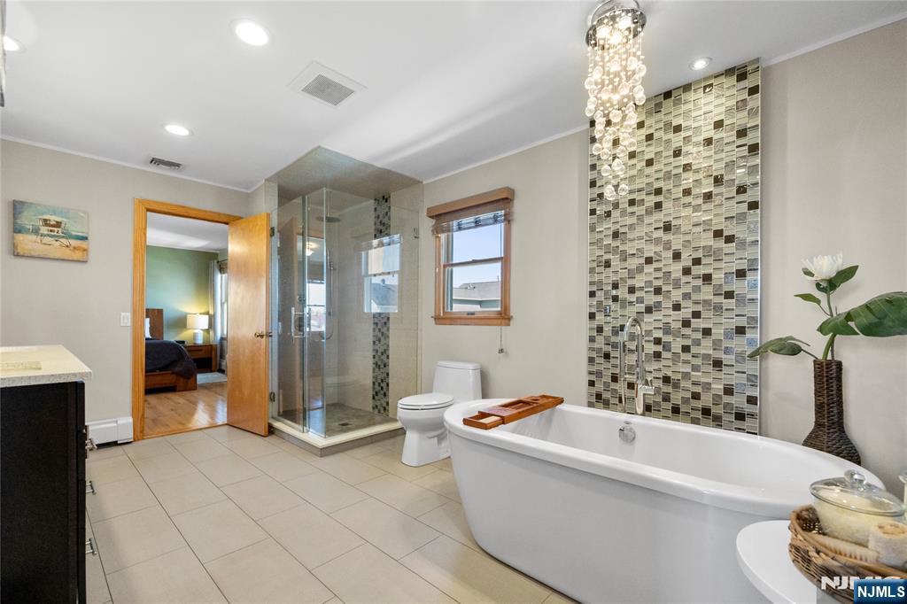 66 Roehrs Drive Wallington, NJ 07057 - Photo 17 of 37 a bathroom with a bathtub and shower