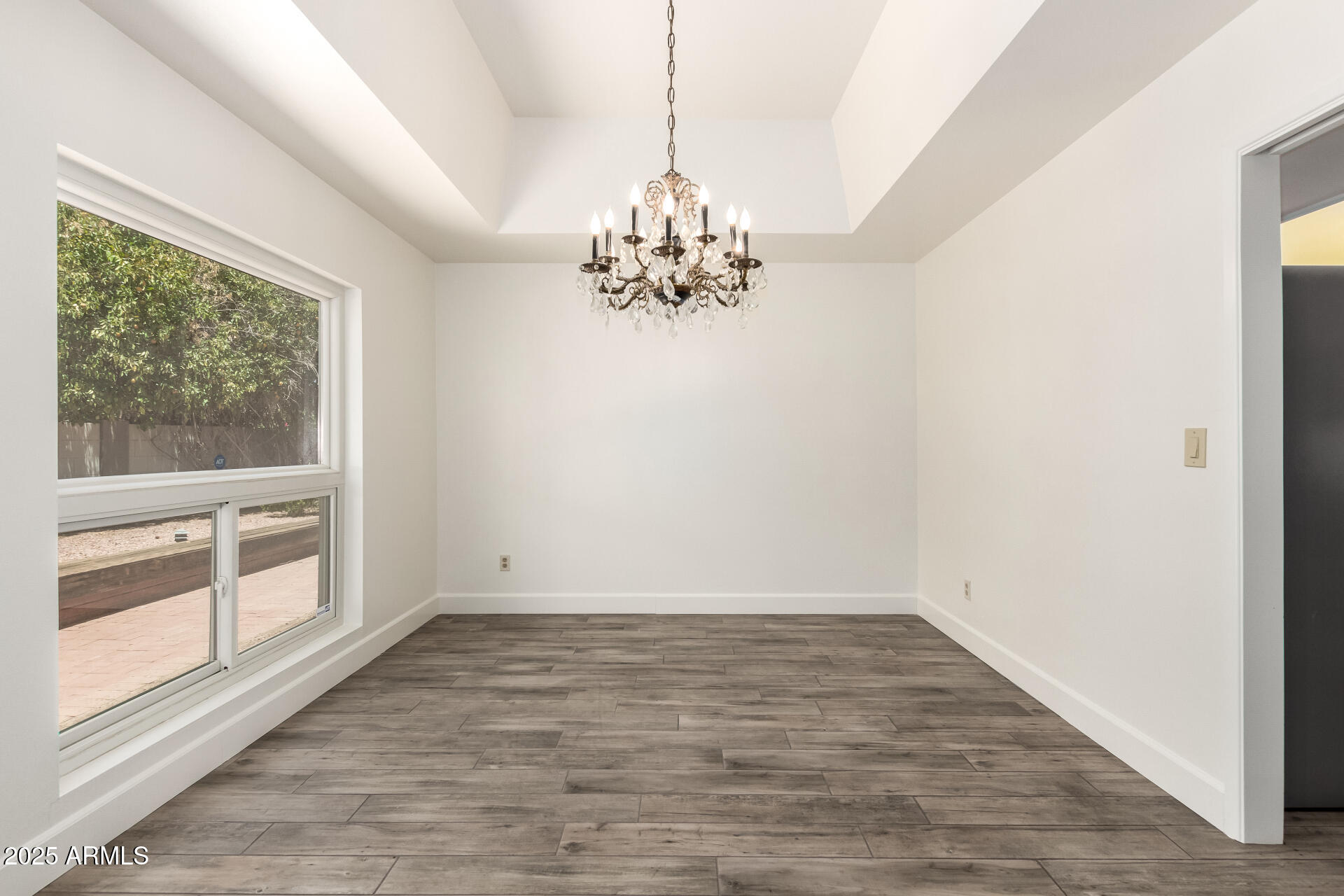 38 East Calavar Road Phoenix, AZ 85022 - Photo 14 of 45 a view of a room with window and hardwood floor