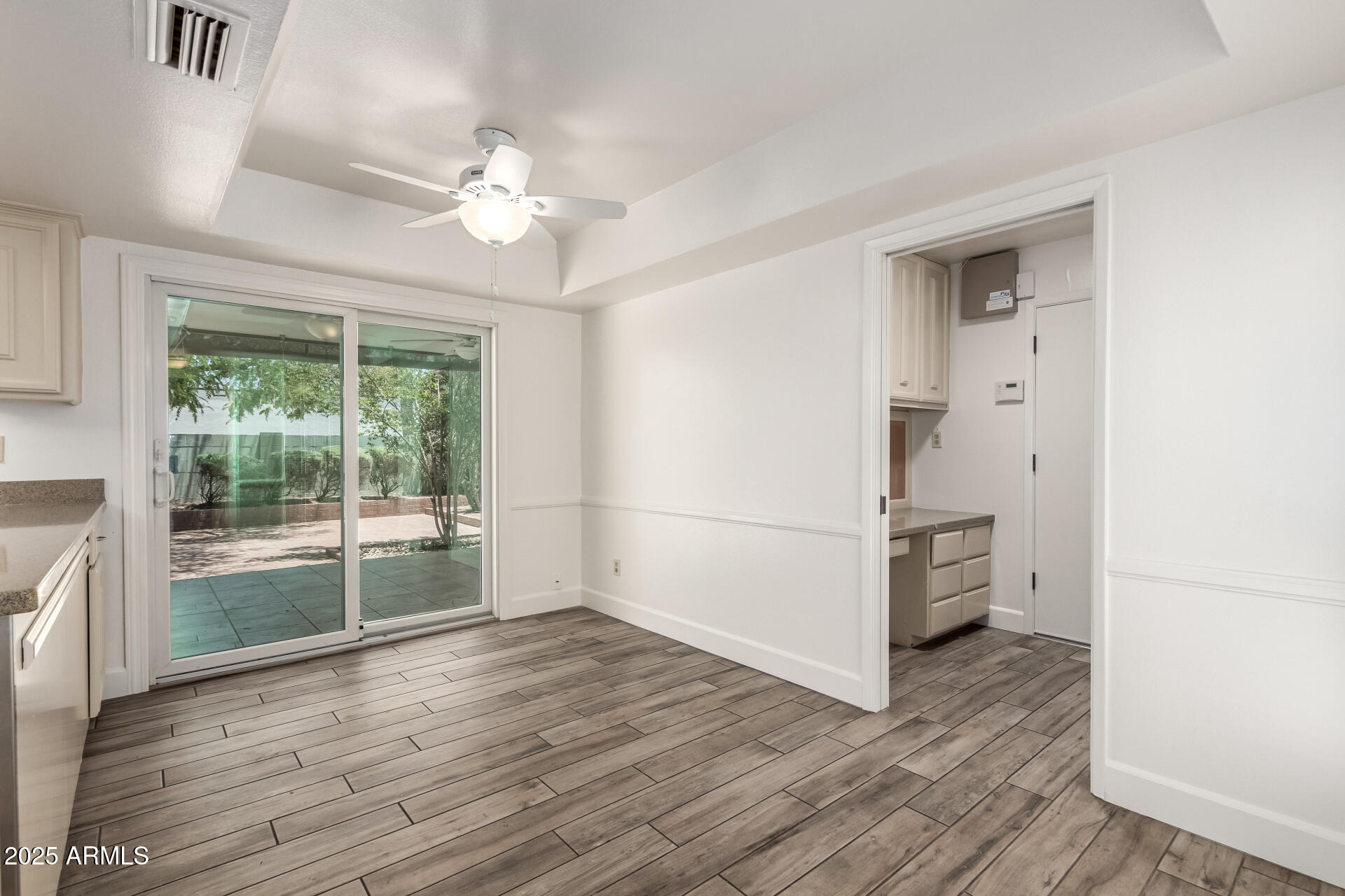 38 East Calavar Road Phoenix, AZ 85022 - Photo 16 of 45 a view of a room with wooden floor and natural light