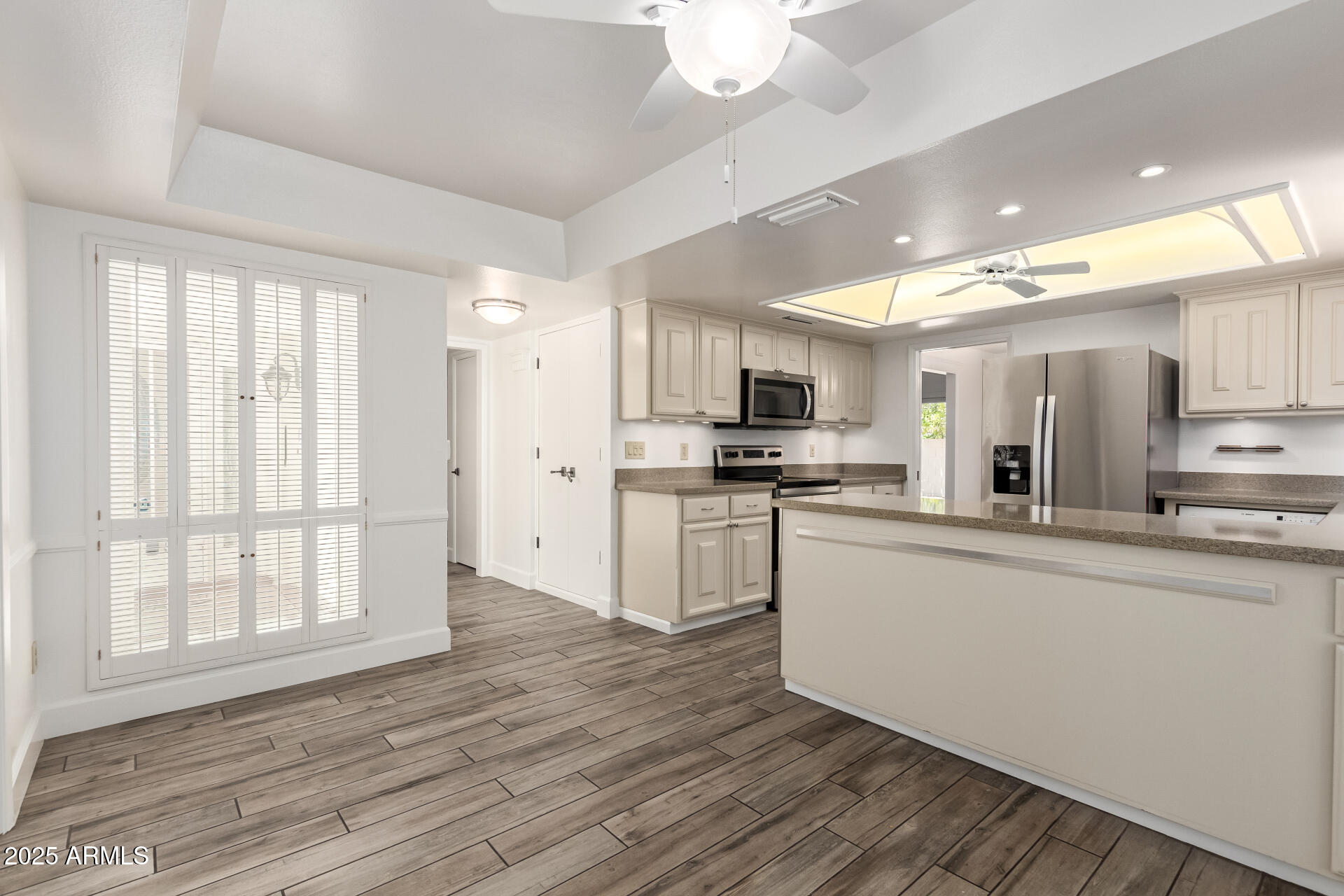 38 East Calavar Road Phoenix, AZ 85022 - Photo 17 of 45 a kitchen with stainless steel appliances a refrigerator sink and microwave