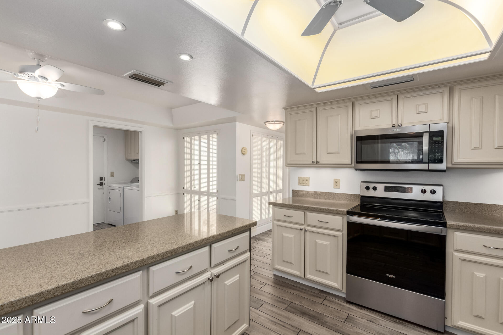 38 East Calavar Road Phoenix, AZ 85022 - Photo 19 of 45 a kitchen with a sink stove and microwave
