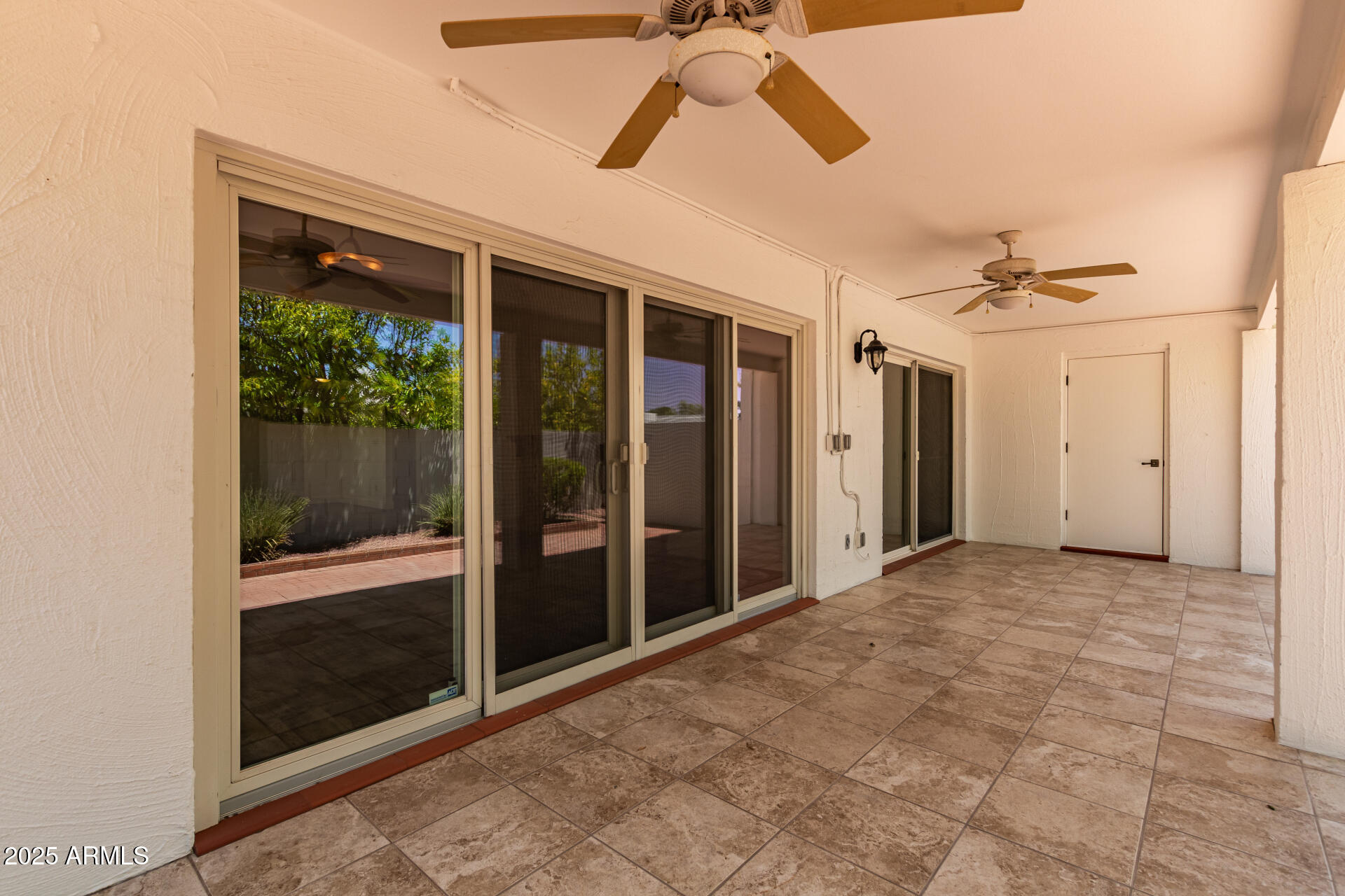 38 East Calavar Road Phoenix, AZ 85022 - Photo 38 of 45 a view of a hallway with a glass door and shower