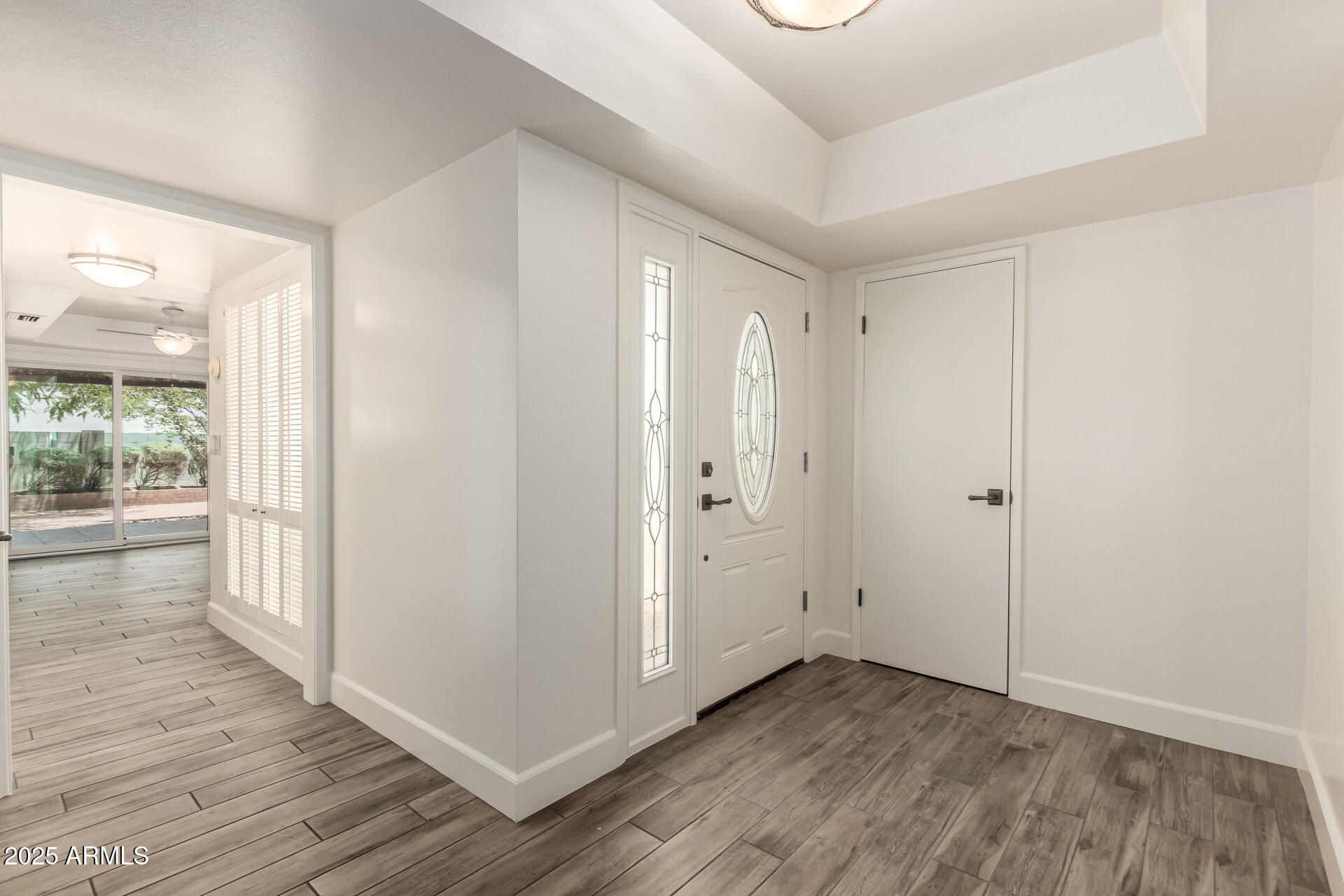 38 East Calavar Road Phoenix, AZ 85022 - Photo 8 of 45 a view of a hallway with wooden floor