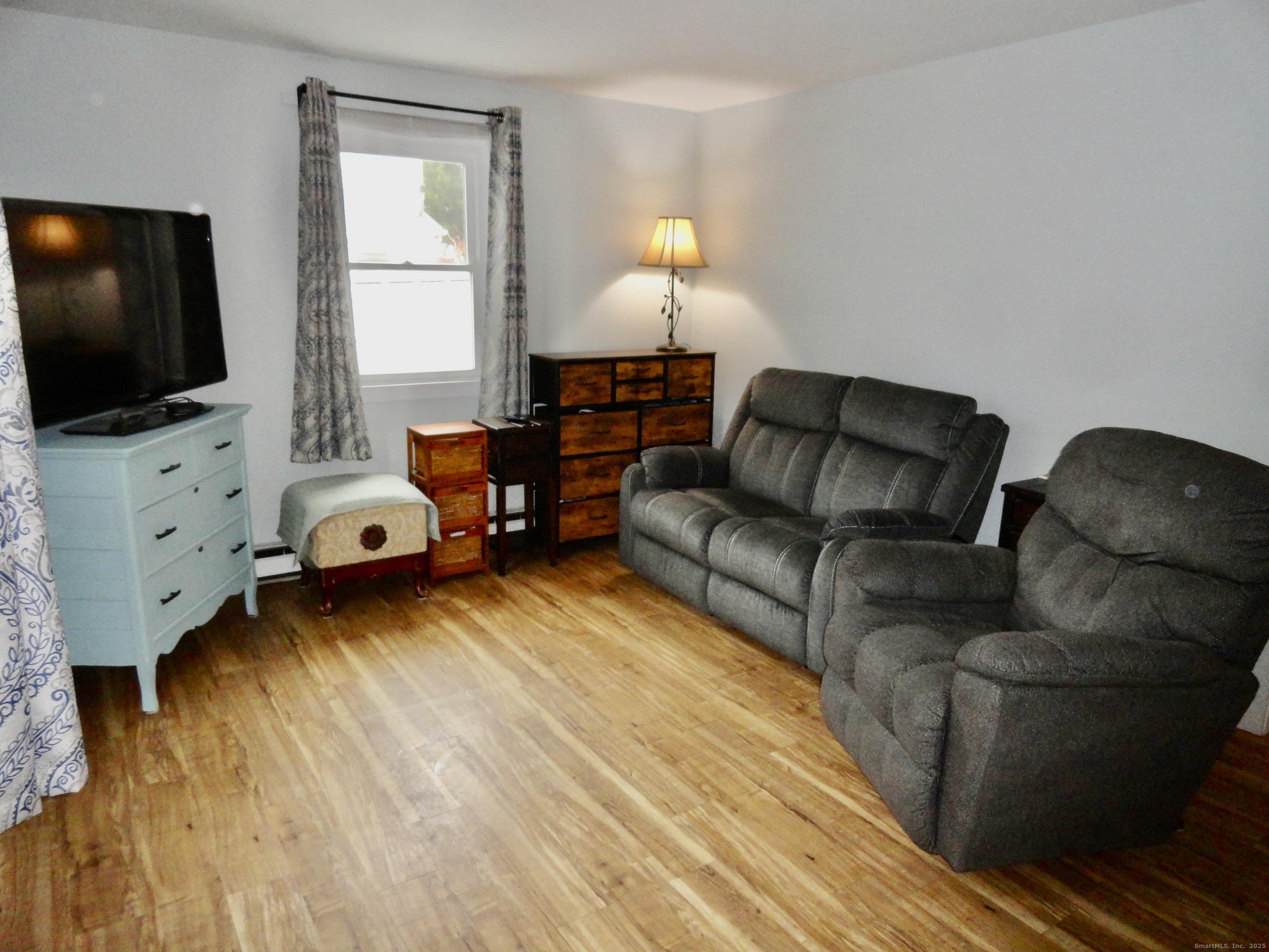 35 Calli Street Torrington, CT 06790 - Photo 11 of 33 a living room with furniture and a flat screen tv
