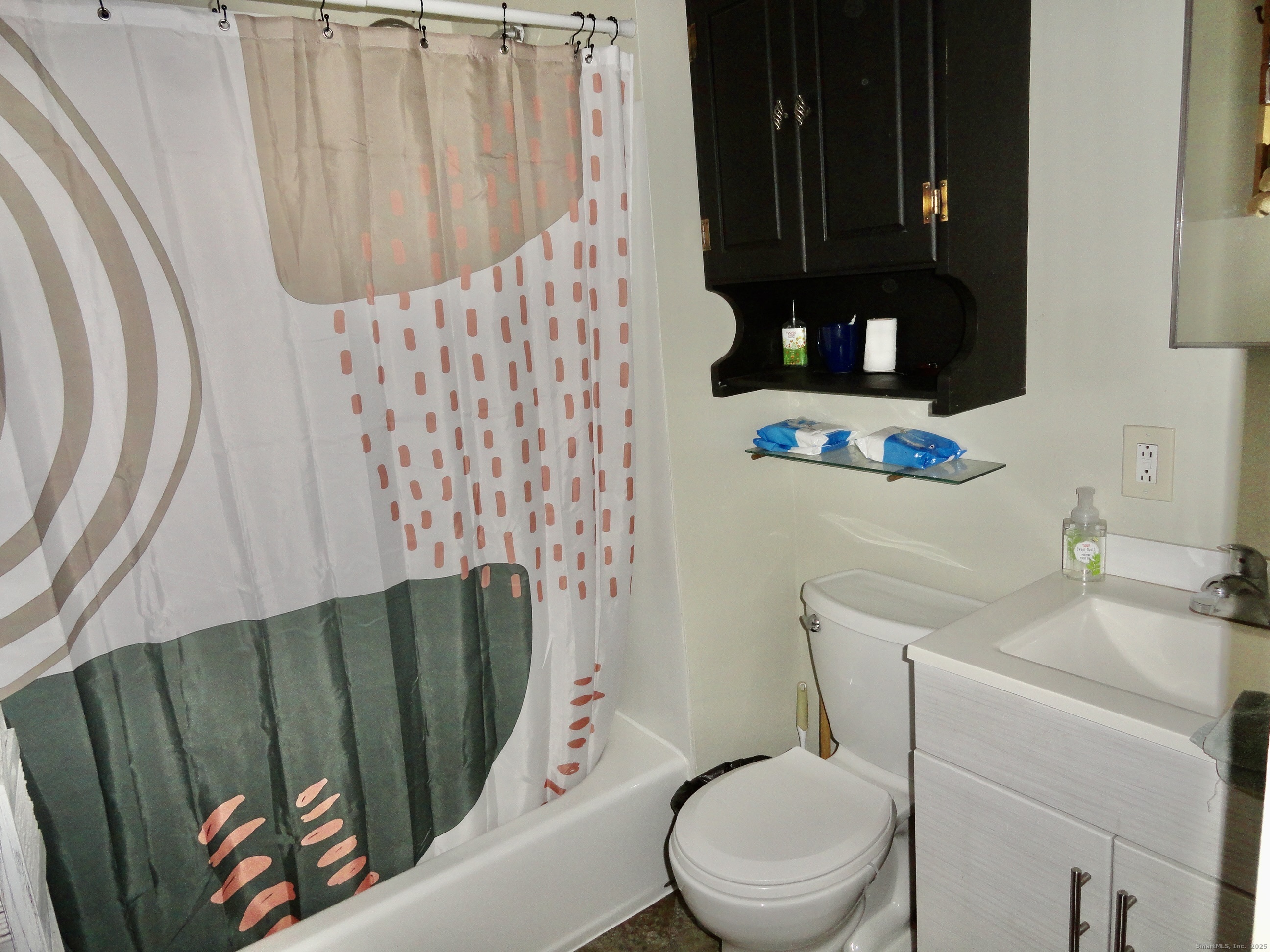 35 Calli Street Torrington, CT 06790 - Photo 22 of 33 a white toilet sitting next to a shower curtain