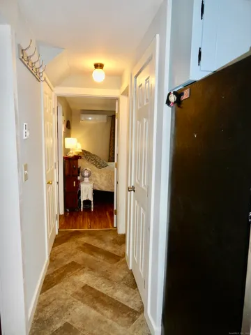 a view of a bathroom from the hallway