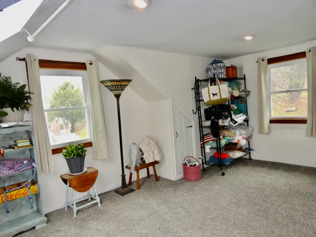 a view of room with workspace and windows