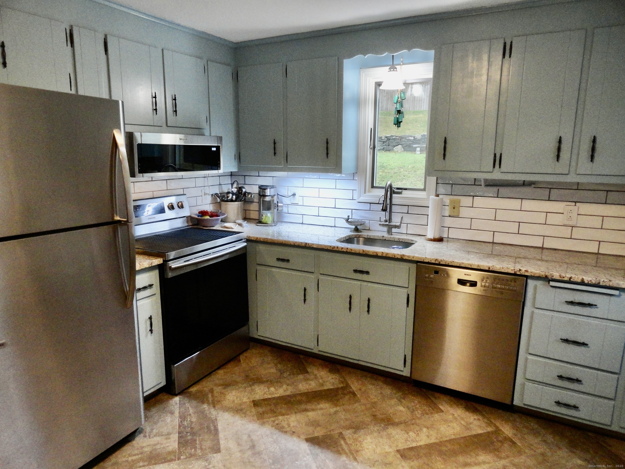 35 Calli Street Torrington, CT 06790 - Photo 5 of 33 a kitchen with stainless steel appliances granite countertop a refrigerator sink and stove