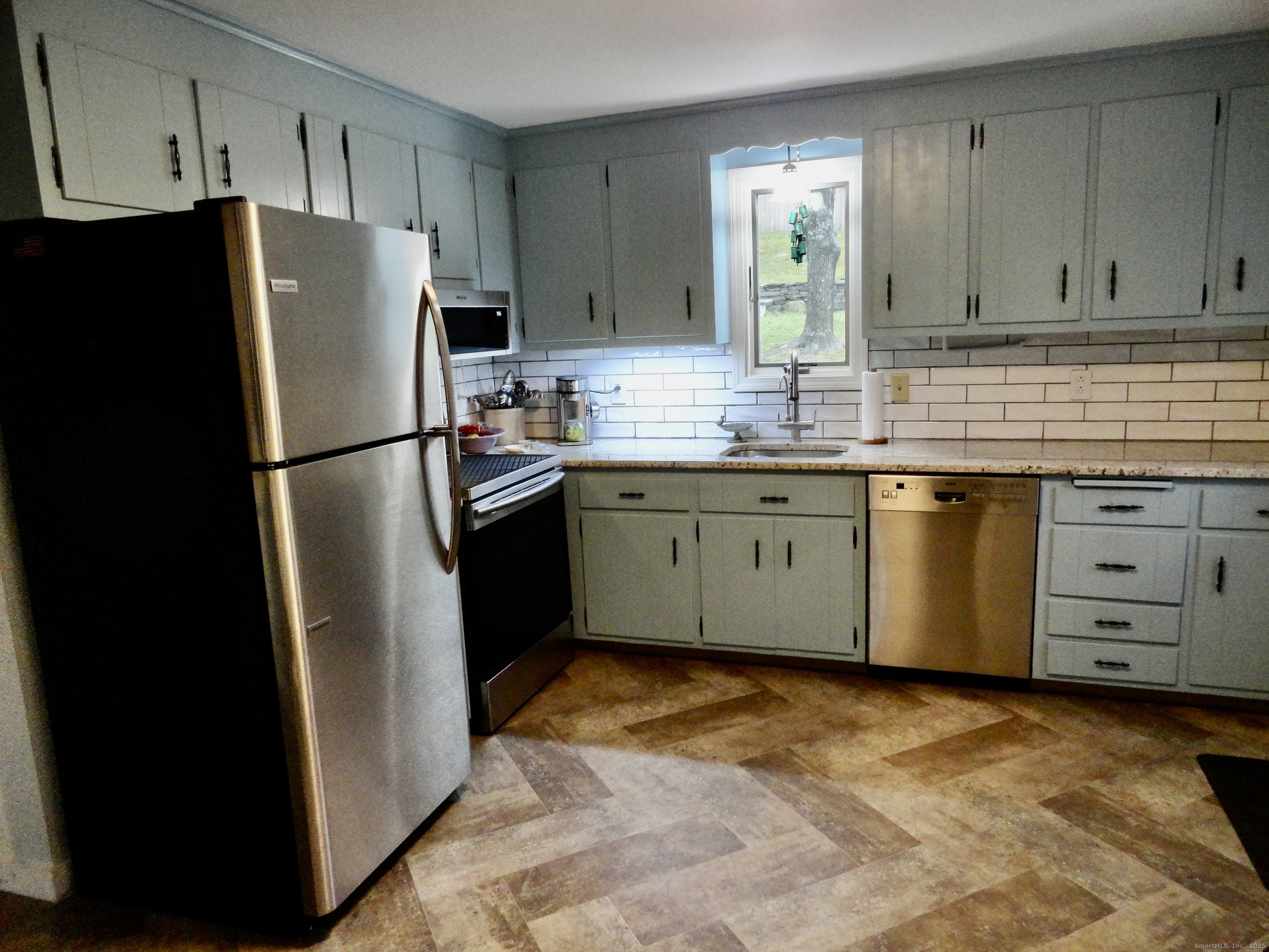 35 Calli Street Torrington, CT 06790 - Photo 6 of 33 a kitchen with stainless steel appliances a refrigerator sink and cabinets
