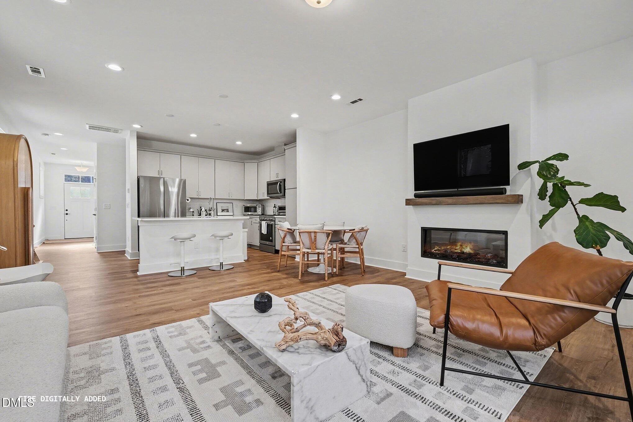 4019 Emerald Green Road Raleigh, NC 27612 - Photo 6 of 36 006_fire_digitally_added_-_living_room_2