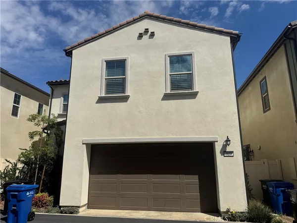 a front view of a house with garage
