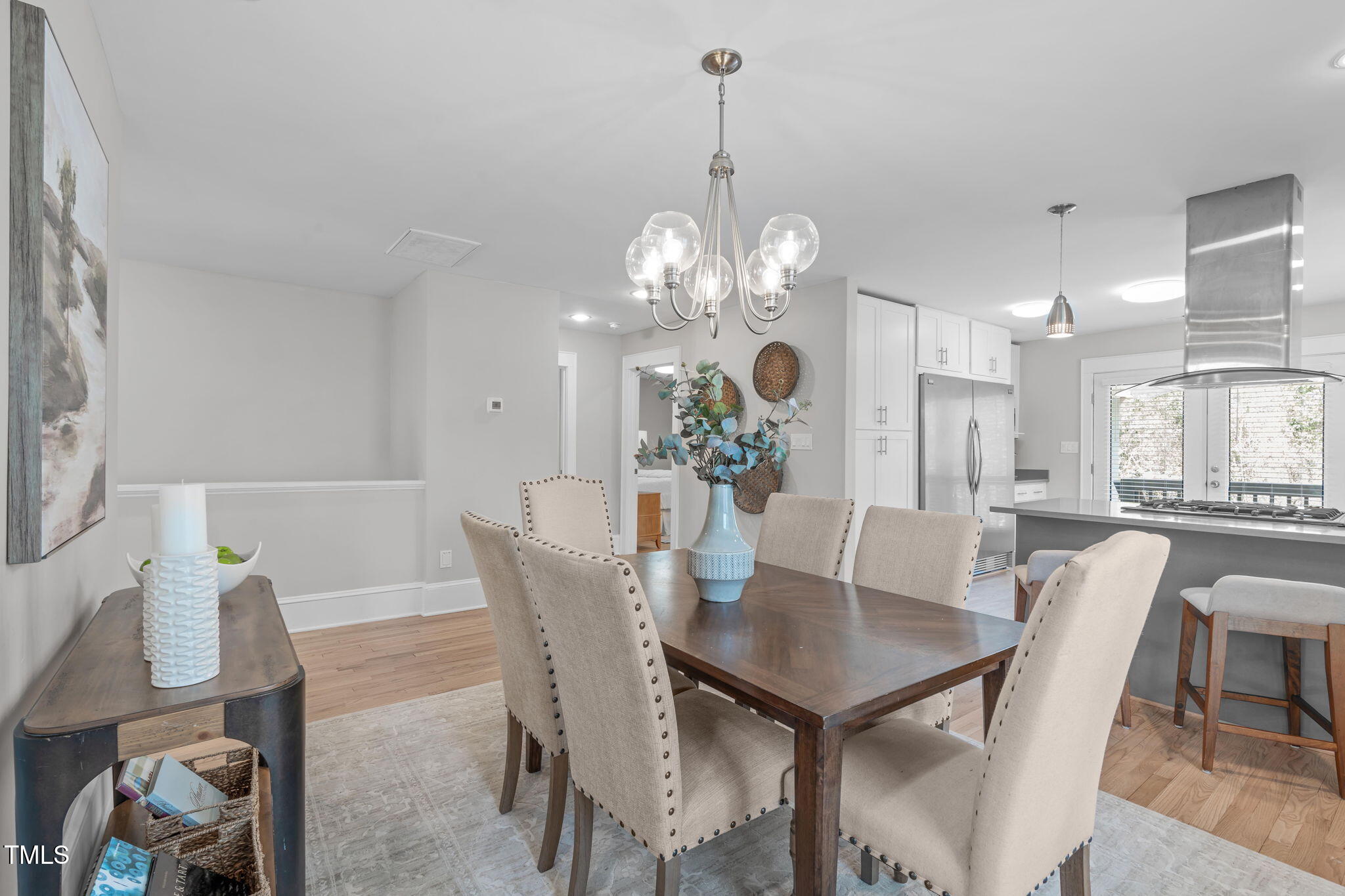 1900 Sunset Avenue Durham, NC 27705 - Photo 19 of 53 a view of a dining room with furniture a chandelier and wooden floor