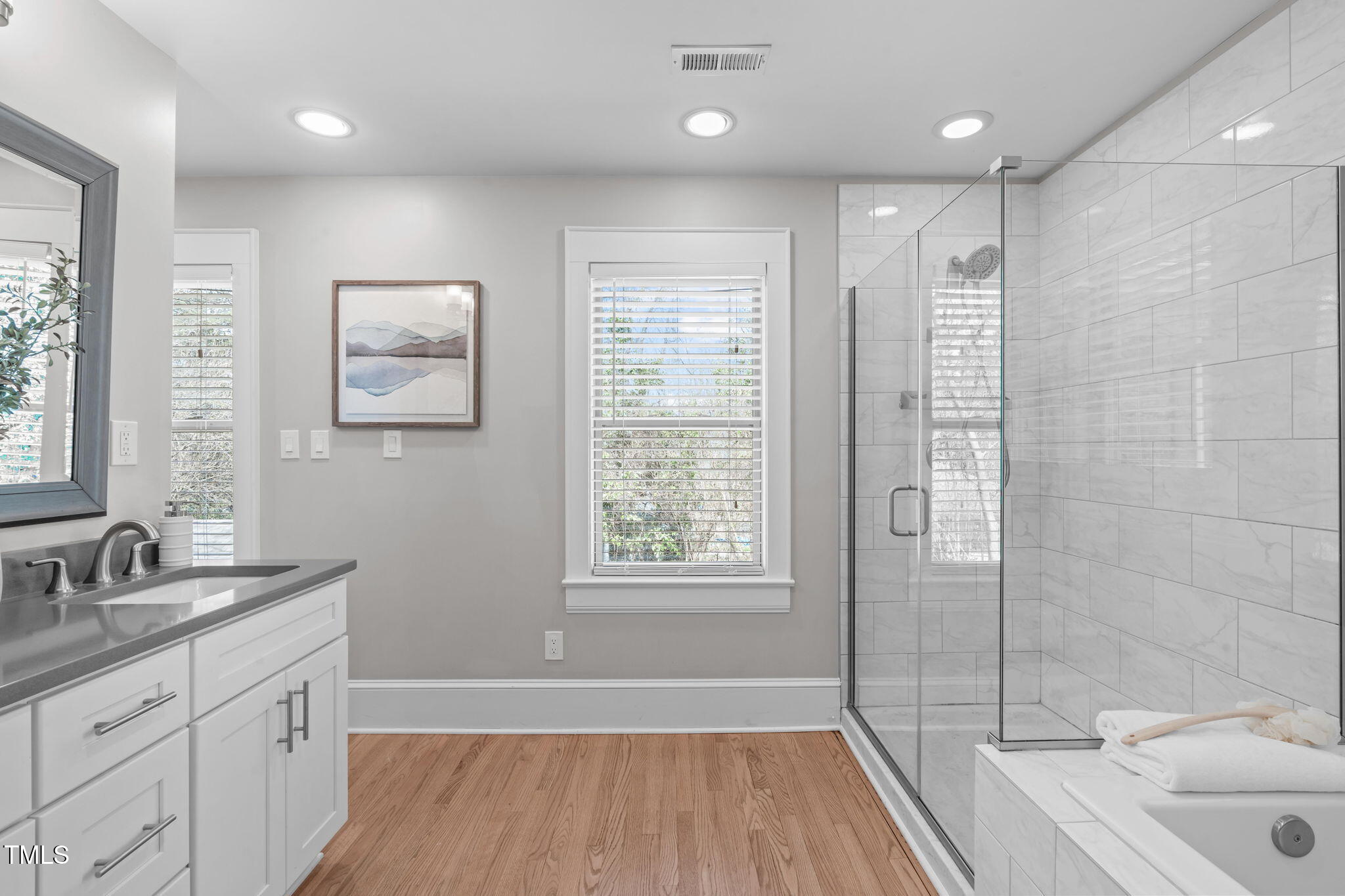 1900 Sunset Avenue Durham, NC 27705 - Photo 30 of 53 a bathroom with double vanity and a shower