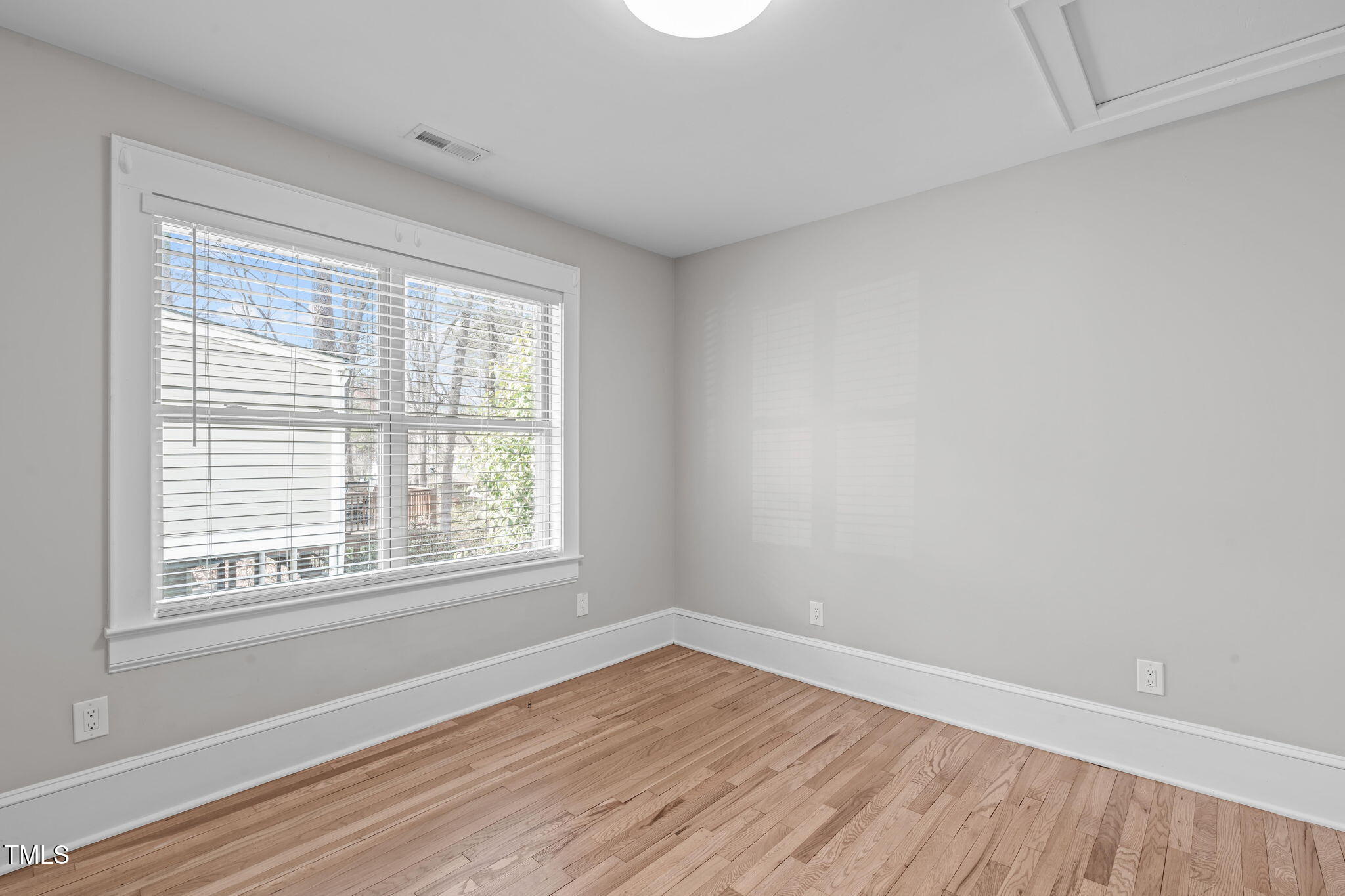 1900 Sunset Avenue Durham, NC 27705 - Photo 40 of 53 an empty room with wooden floor and windows