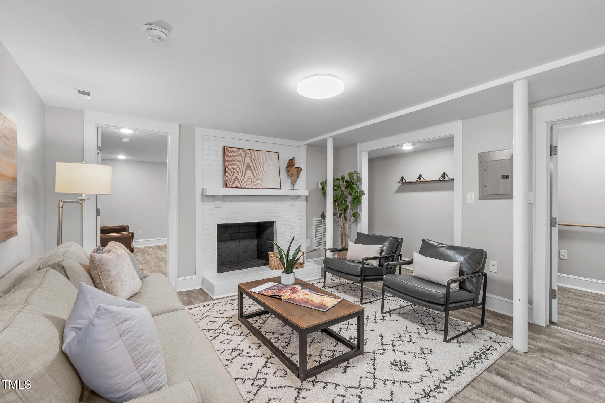 1900 Sunset Avenue Durham, NC 27705 - Photo 43 of 53 a living room with furniture a rug and a fireplace