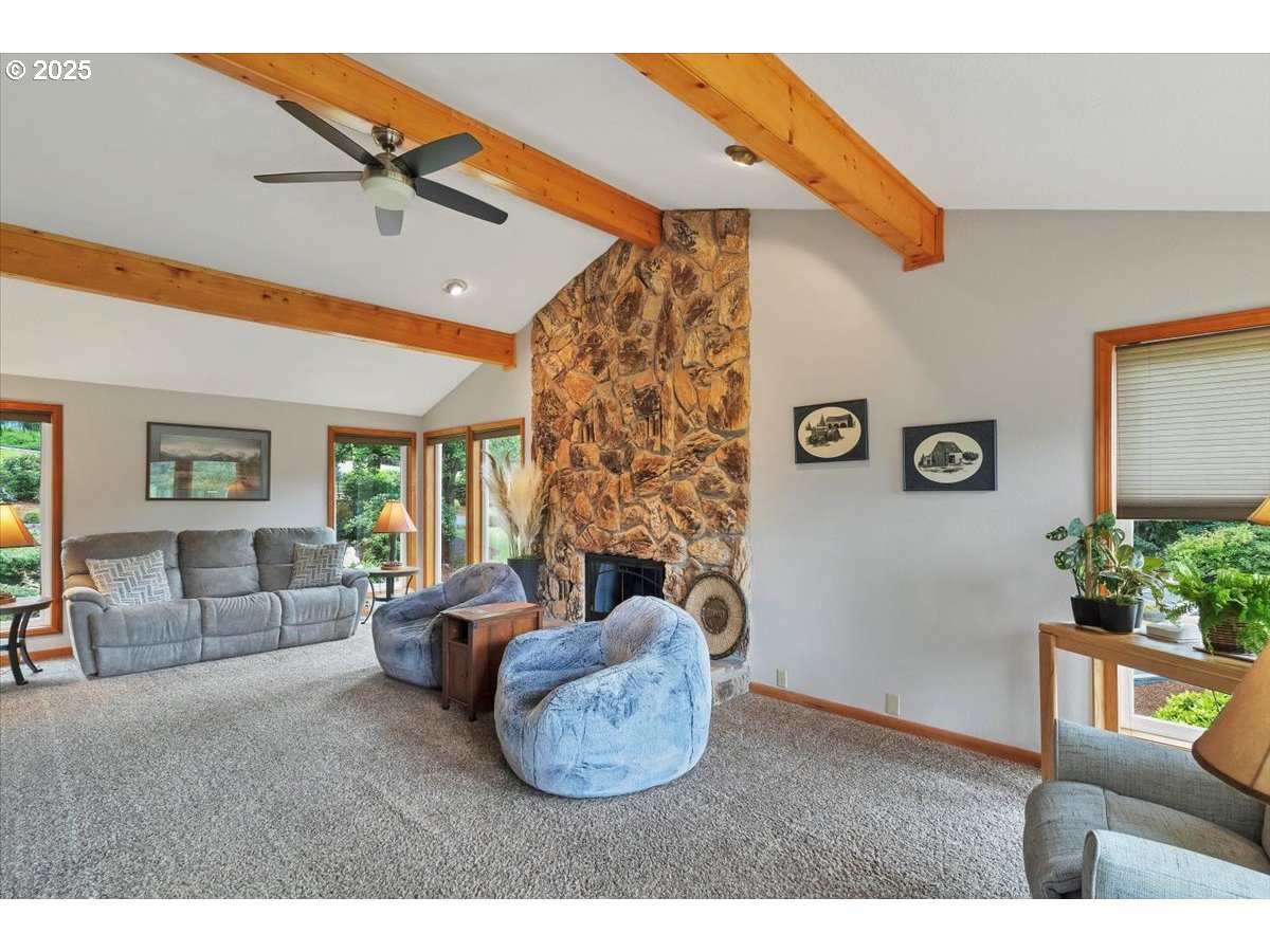 9076 Daleview Road Southeast Salem, OR 97317 - Photo 14 of 45 a living room with furniture and a fireplace