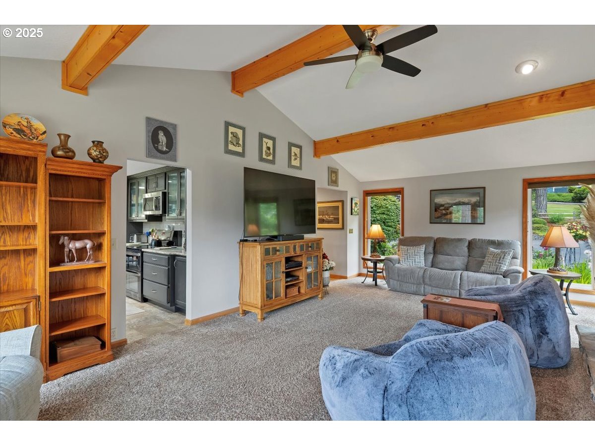 9076 Daleview Road Southeast Salem, OR 97317 - Photo 17 of 45 a living room with furniture and a flat screen tv