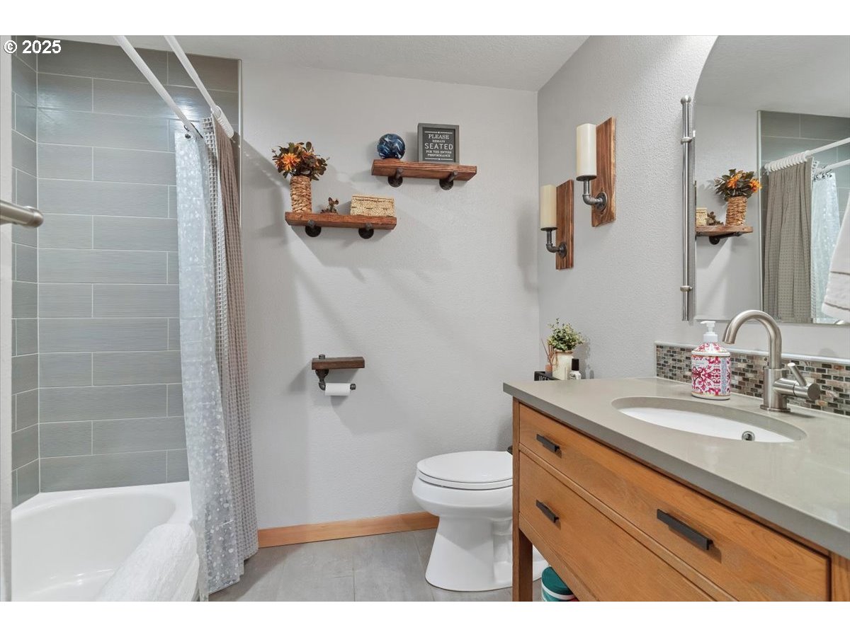 9076 Daleview Road Southeast Salem, OR 97317 - Photo 18 of 45 a bathroom with a sink a toilet and a shower