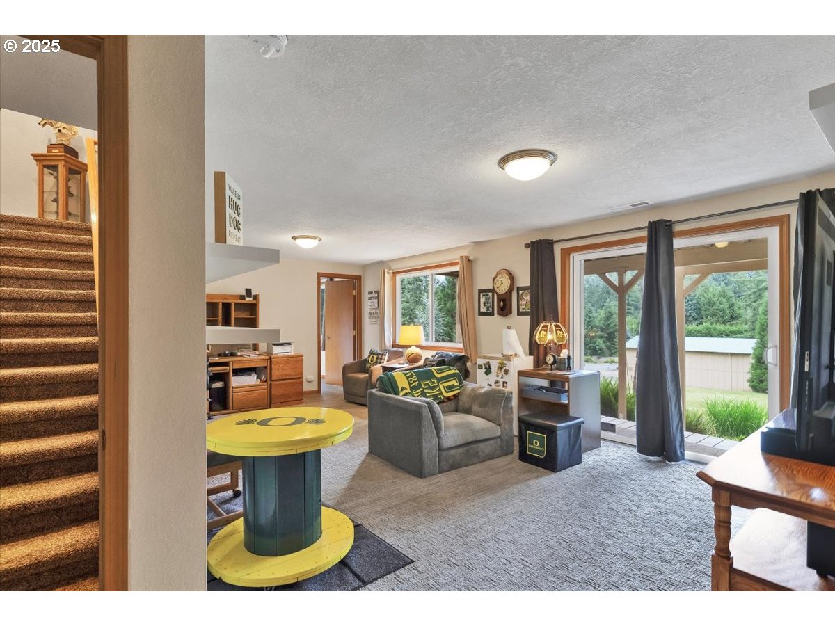 9076 Daleview Road Southeast Salem, OR 97317 - Photo 25 of 45 a living room with furniture a window and a table