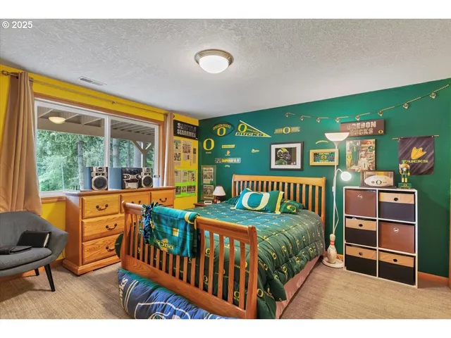 a bedroom with furniture and a window